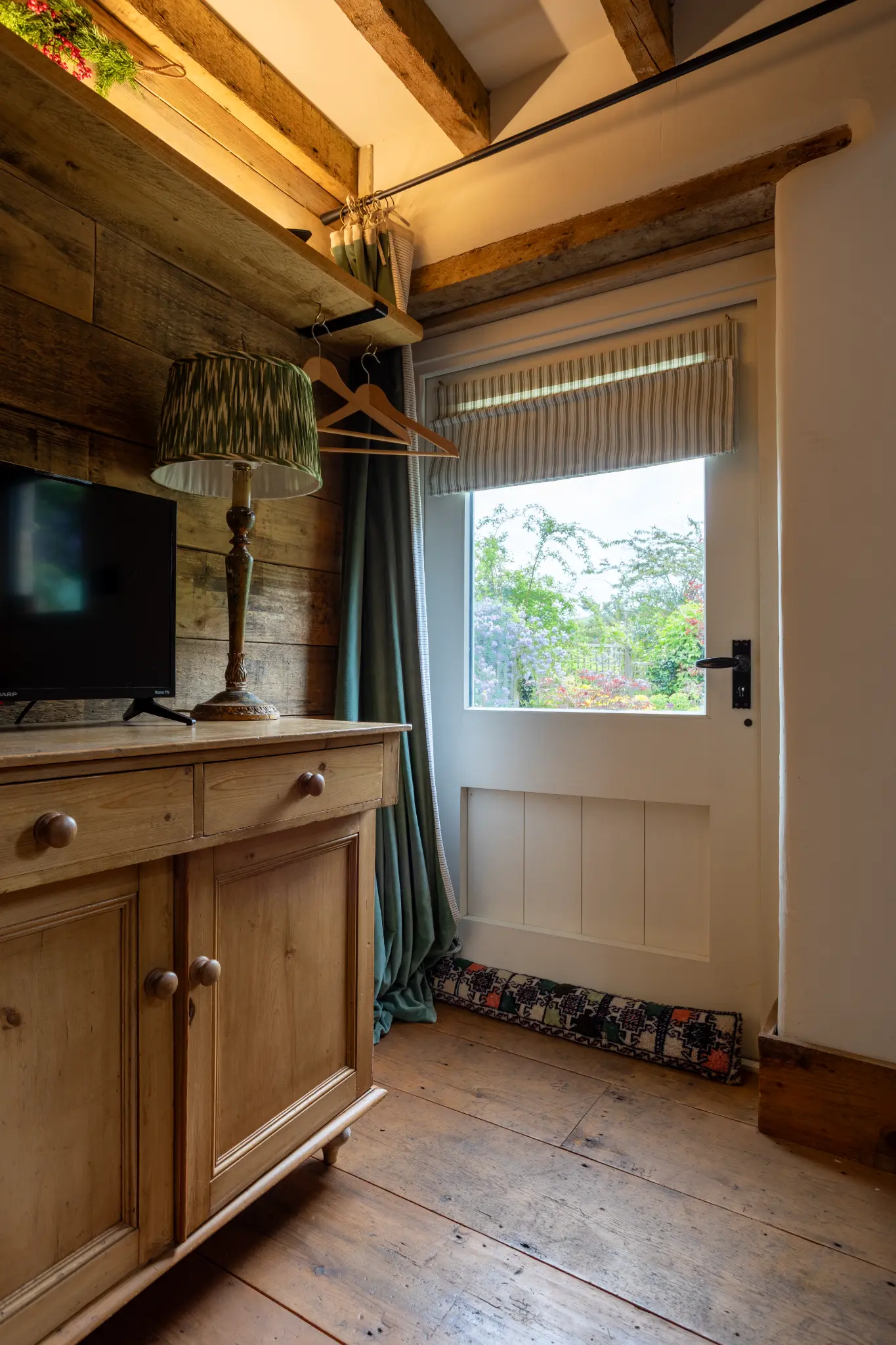 Main bedroom in Wiltshire Airbnb with quality bedding and warm lighting
