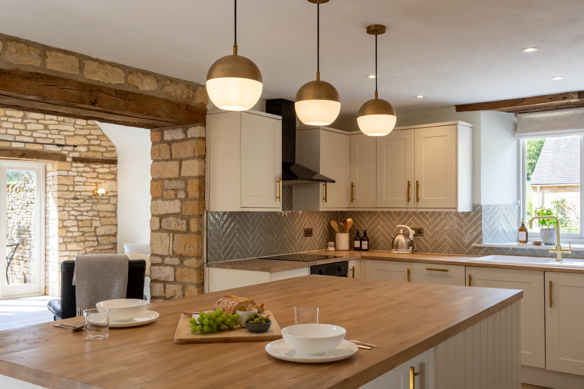 Kitchen island with pendant lights and breakfast bar