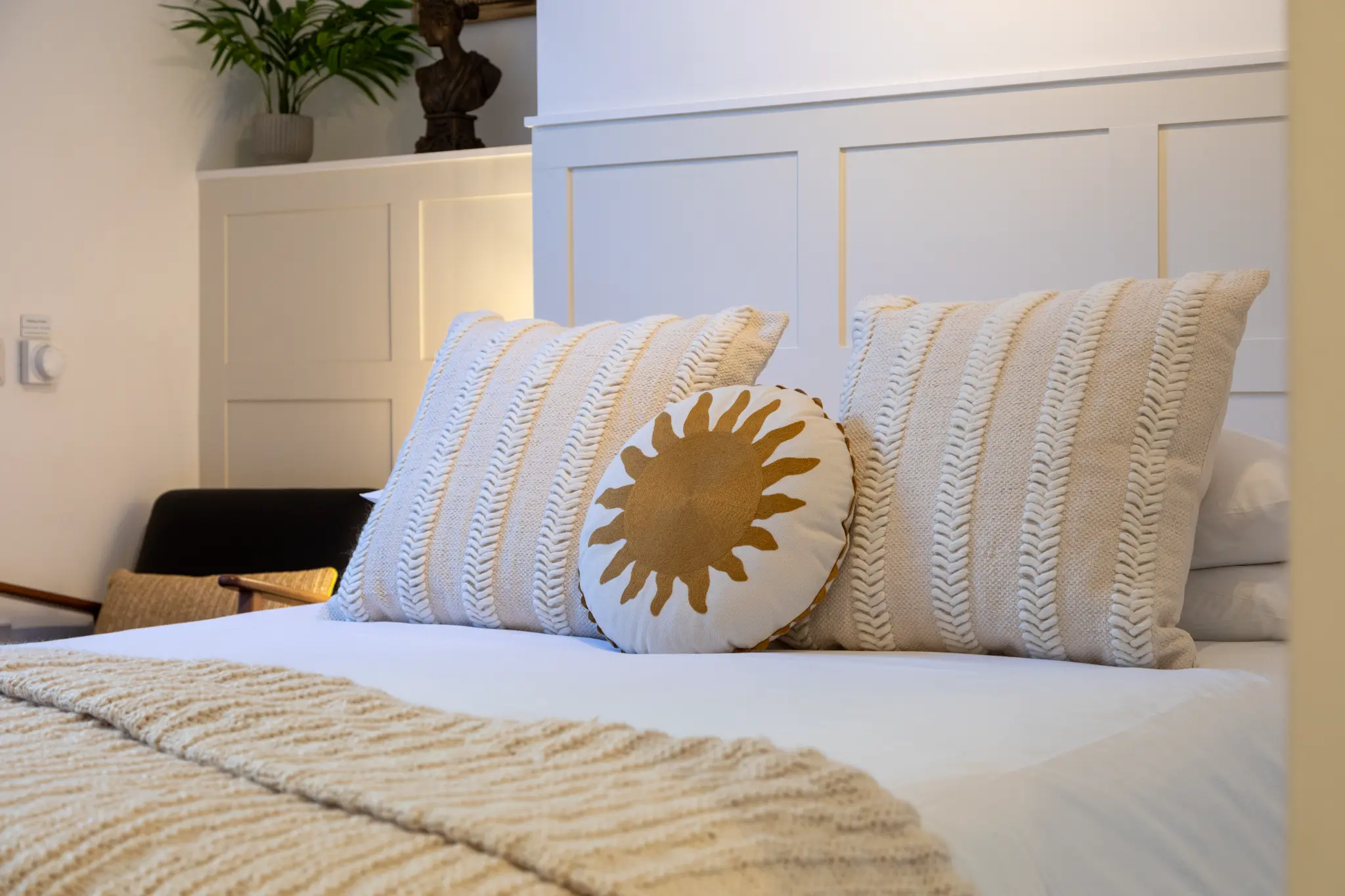 Close-up of textured pillows and sun cushion at Ferndale Mews