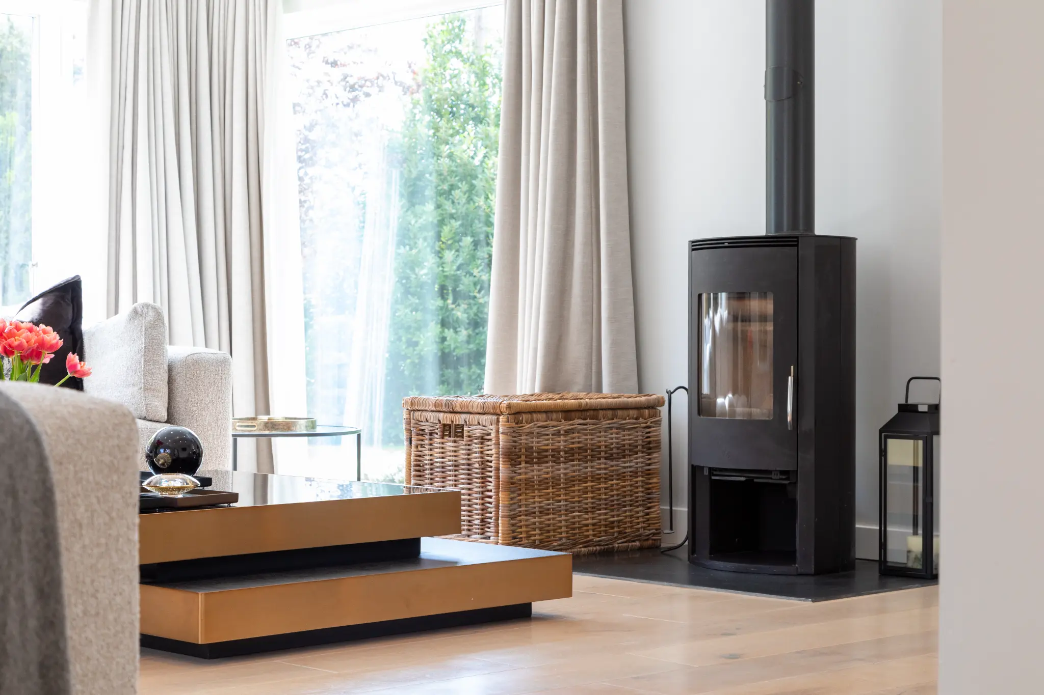 Living room with a wood burner and wicker baskets