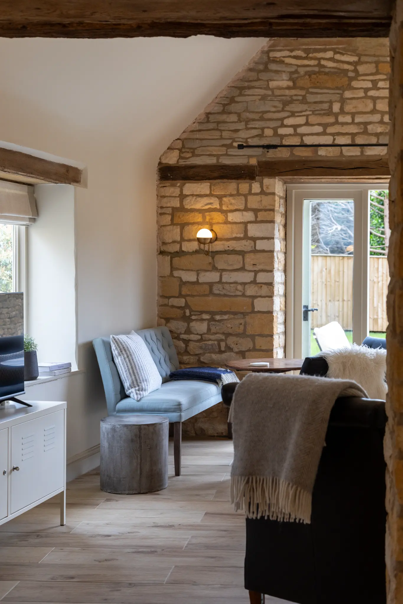 Cosy corner with layered throws and cushions
