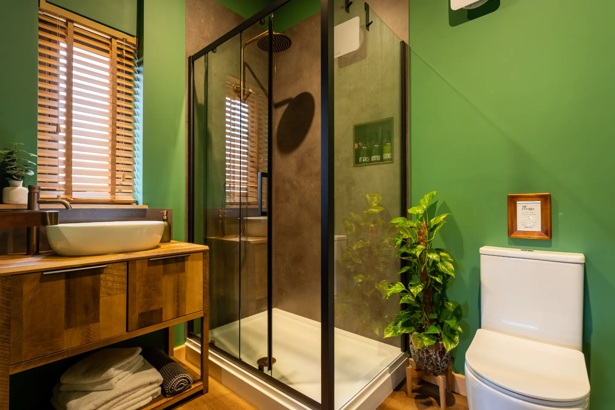 En-suite shower room at Ochre Hill with stone basin on a timber vanity and walk-in shower
