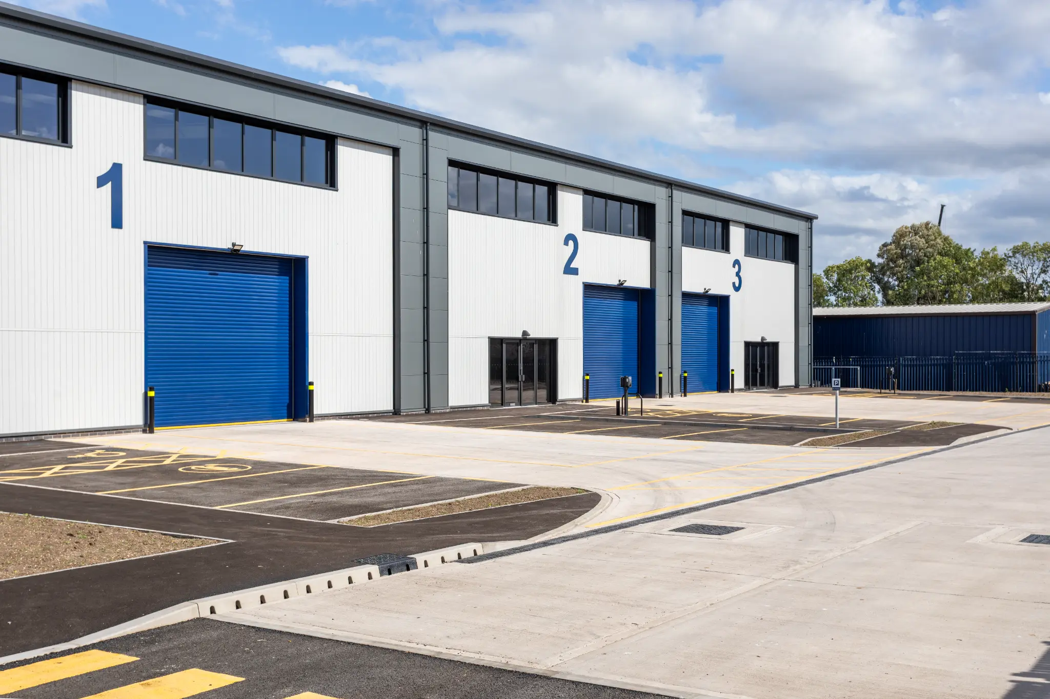 Numbered commercial bays with modern metal cladding at Rotor Trade Park