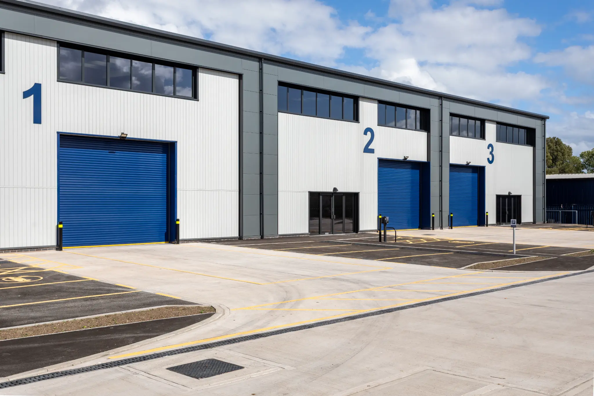 Commercial loading bays and numbered unit façades in Yeovil